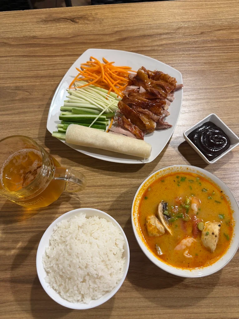 Roast duck pancakes and coconut seafood curry with steamed rice